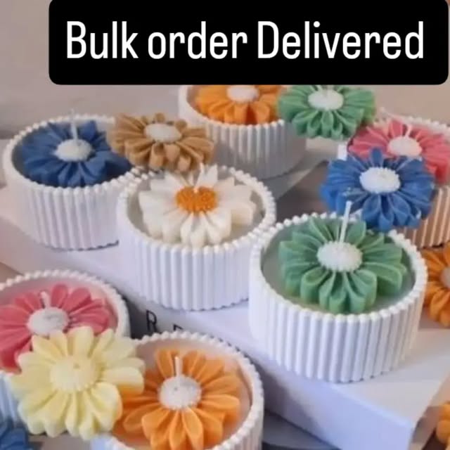 Colourful daisy candles from a delivered bulk order